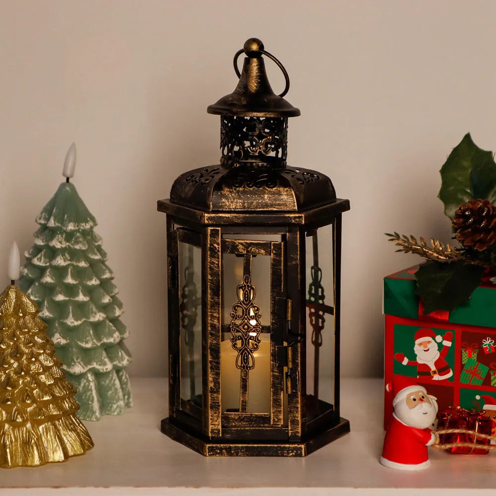 Black retro metal candle holder with glass insert on a wooden surface