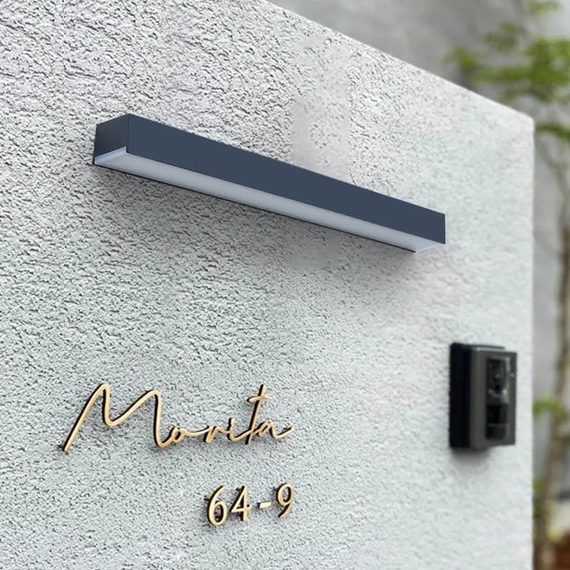 Black solar garden wall light with solar panel and IP65 waterproof rating
