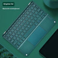 Square Hat touch Bluetooth wireless keyboard in green with wireless charging pad visible.
