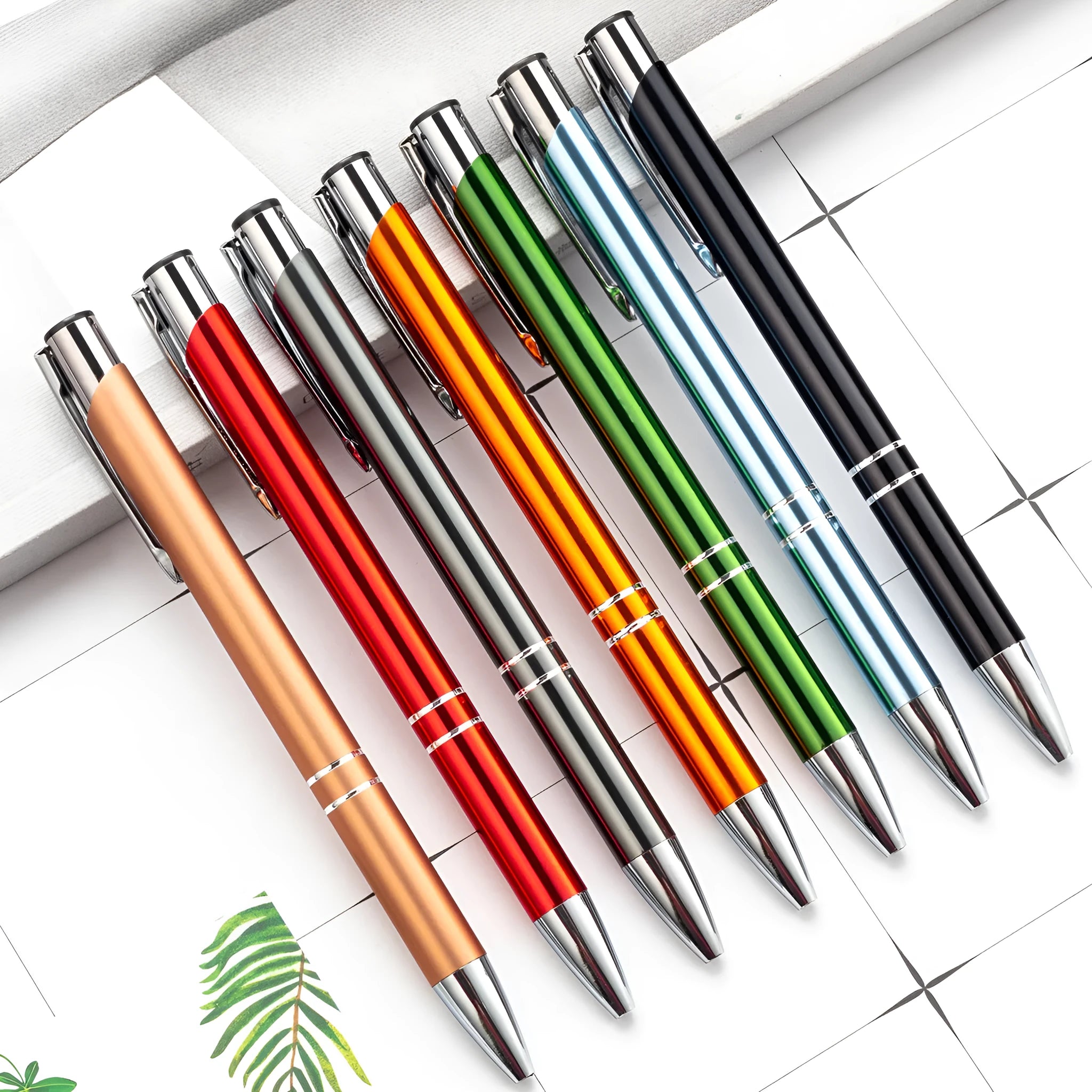 Metal ballpoint pen with push mechanism shown in multiple colour options