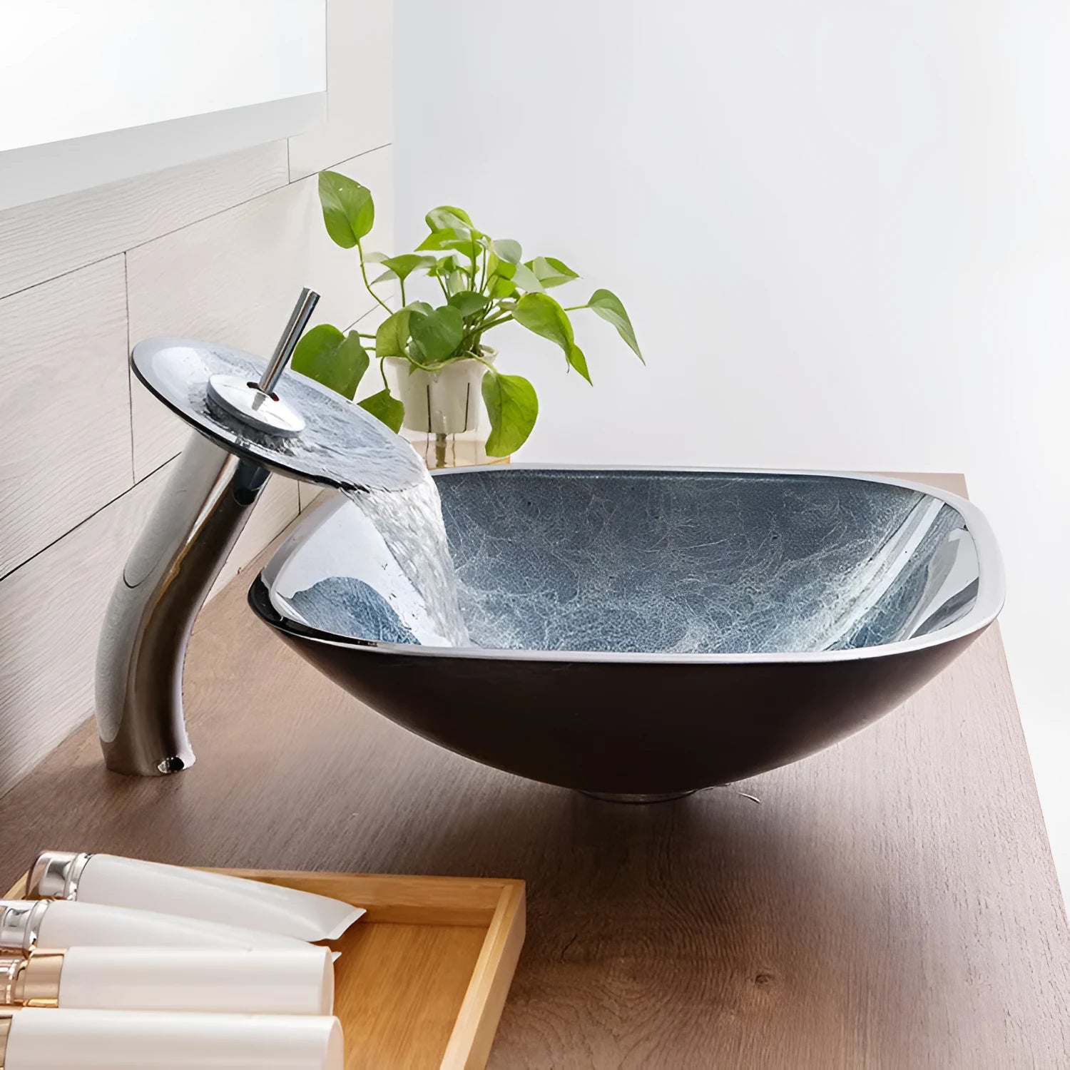 Modern blue-grey tempered glass table basin with a simple design for bathroom vanity units.