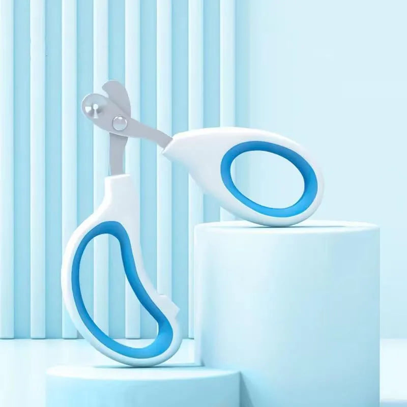 Blue cat nail clippers with circular cut hole and cushioned non-slip handles for safe pet grooming