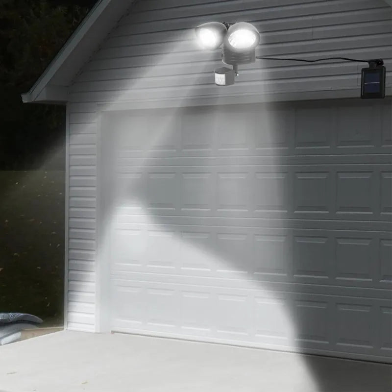 Black or white double-head solar motion sensor spotlight with adjustable brightness for outdoor security