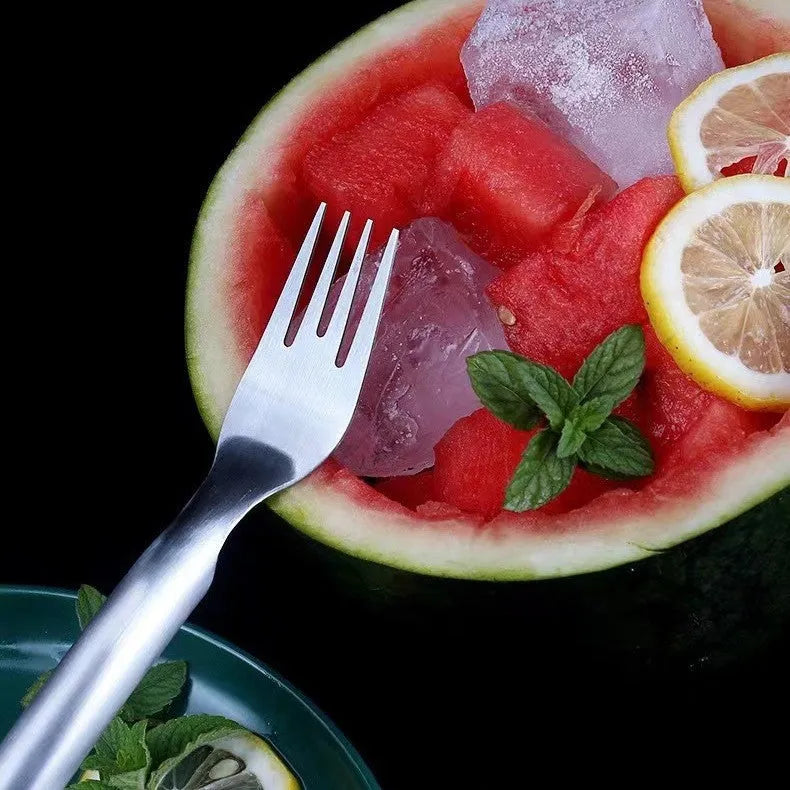 Silver stainless steel watermelon slicer with a 26cm handle and a 3.6cm wide rounded fork head.