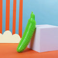Green cucumber-shaped dog teething toy with bite-resistant construction for puppies