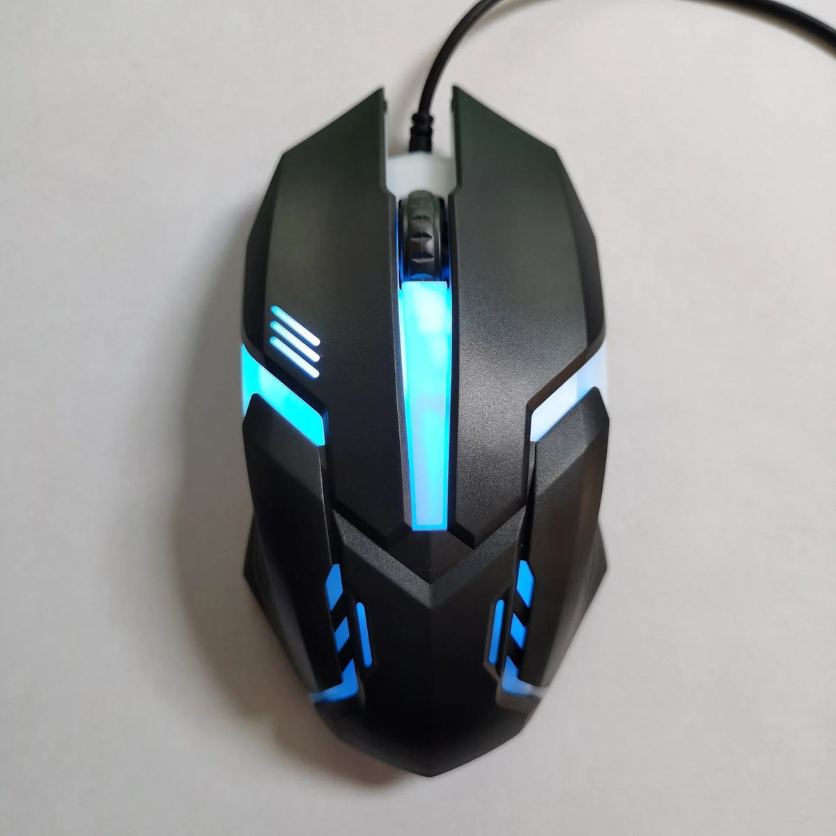 Wired USB photoelectric mouse with 1.35m cable for desktop, shown in black ribbon colour packaging or white