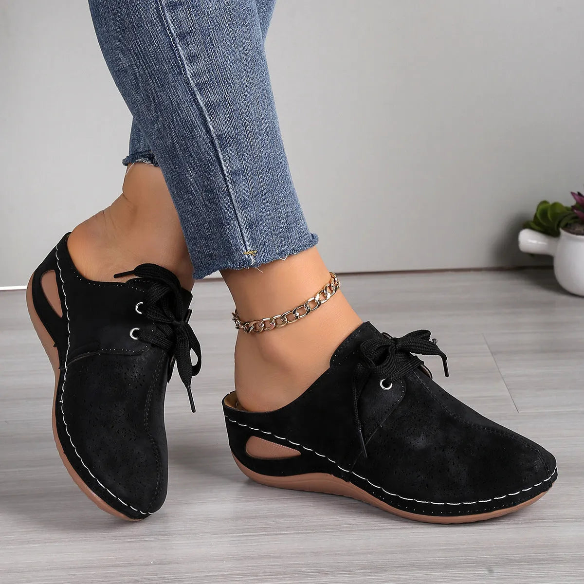 Women's suede lace-up wedge slippers in light grey with a hollow out design and rubber sole.