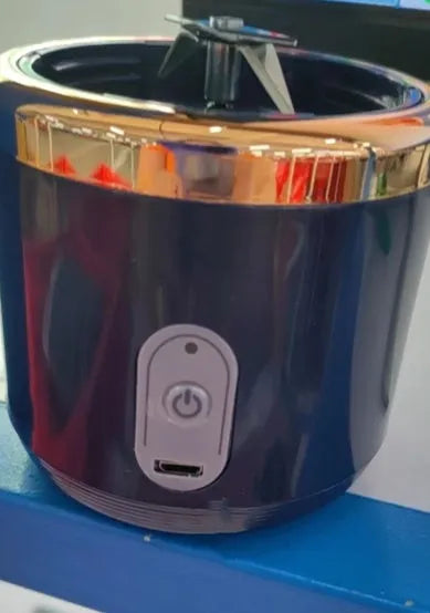 Portable USB blender and juicer in Tunisian dark blue with six blades, a cup lid, and a USB cable.