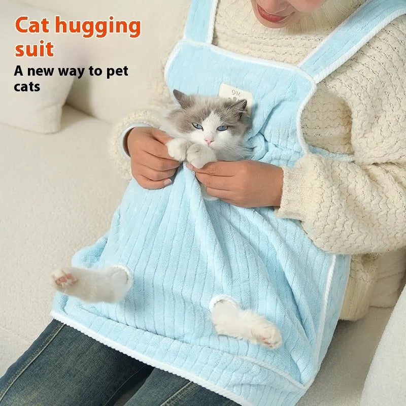 Cloth cat grooming apron worn by person holding a cat, shown in light blue colour with hole option.