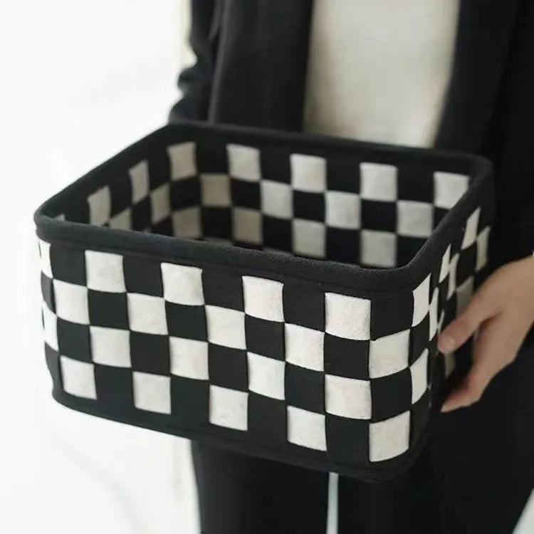 Checkerboard pattern woven felt storage basket folded and unfolded showing dimensions