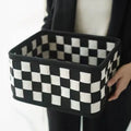 Checkerboard pattern woven felt storage basket folded and unfolded showing dimensions