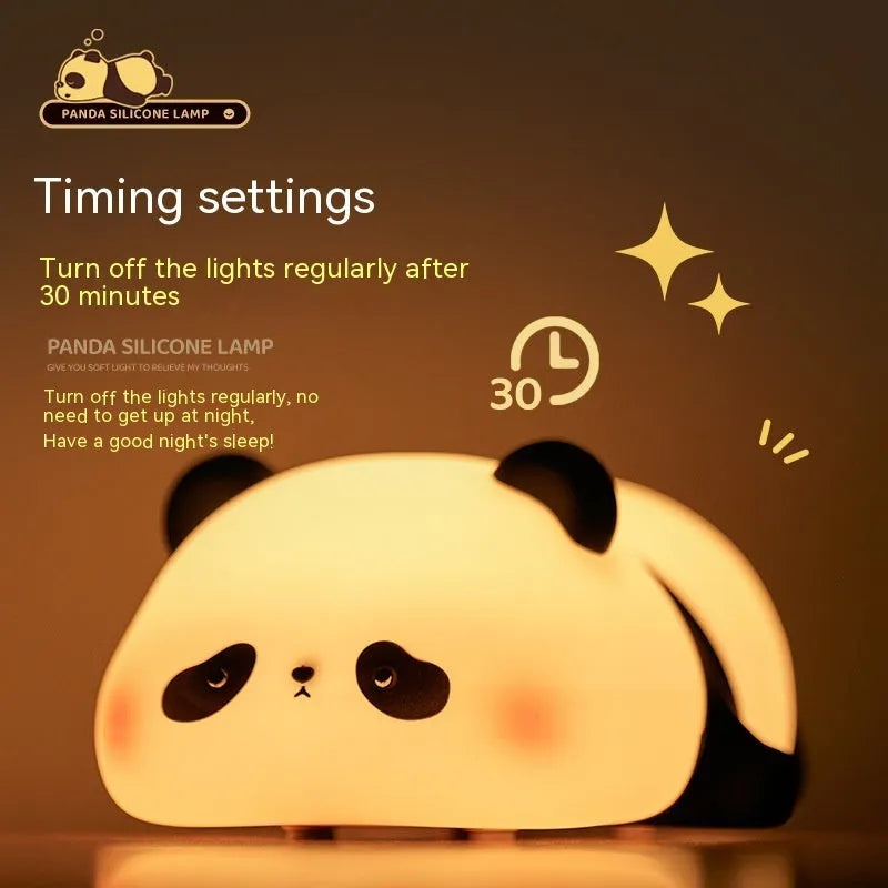 Cute cartoon panda silicone night light for children on a bedside table.
