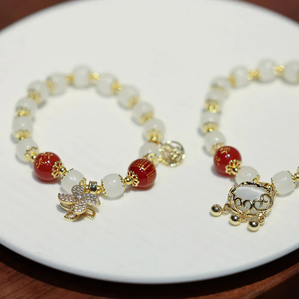 Women's Chinese style coloured glaze glass bracelet with safety lock, windmill, and bamboo charms