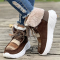 Women's beige lace-up snow boots with fuzzy lining and a thick rubber platform sole