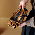 Women's black square toe stiletto heels with horse hair upper and ankle strap.
