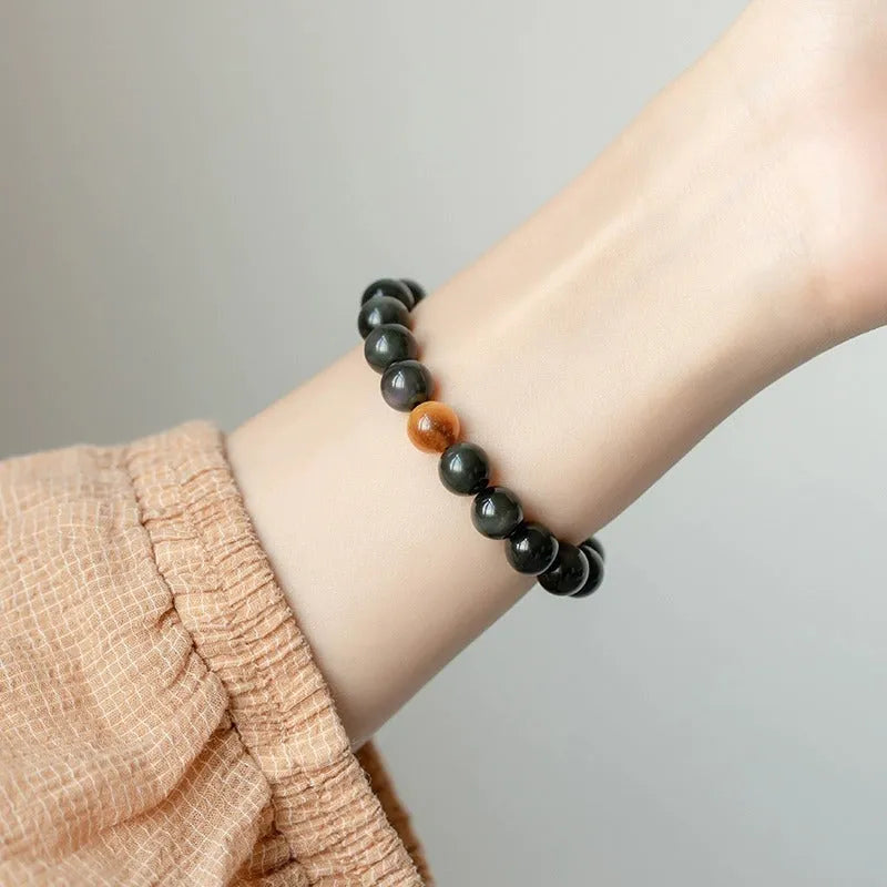 Geometric cut black obsidian stone bracelet showing 6mm, 8mm, and 10mm size beads.