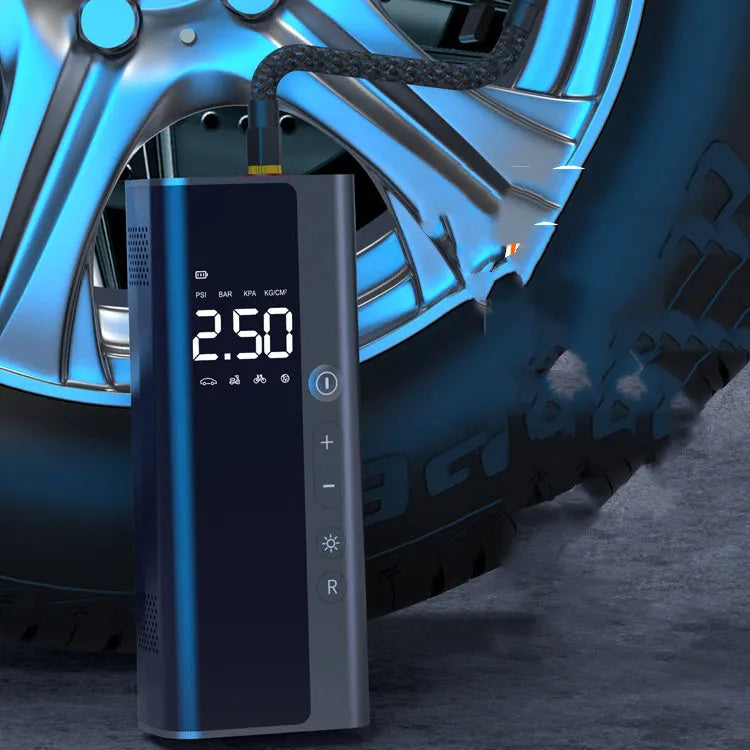 Portable wireless digital air pump on a car tyre with LED light and USB cable