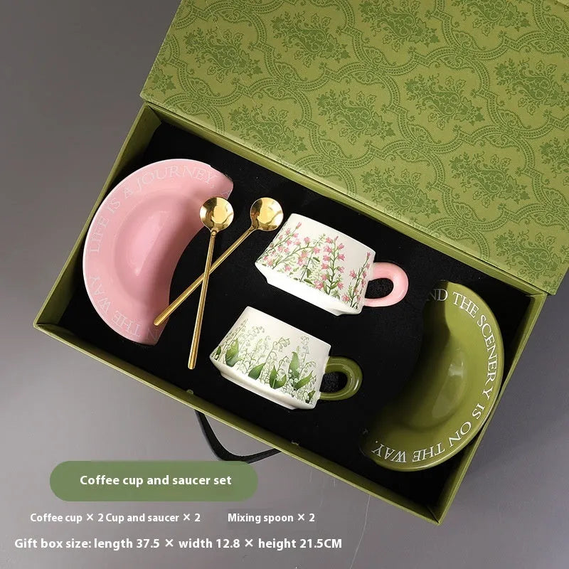 Ceramic coffee cup set with two mugs, saucers, and spoons in Campanula or Lanling Grass designs