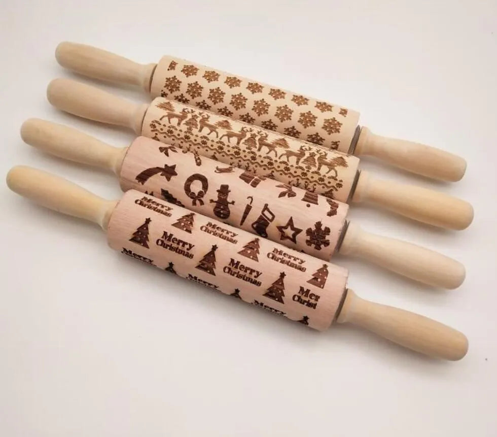 Wooden rolling pin with embossed Christmas patterns, 45cm long, on a kitchen worktop.
