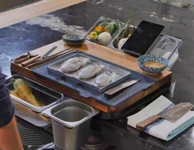 Premium bamboo cutting board with convenient storage trays for chopping, slicing, and dicing ingredients