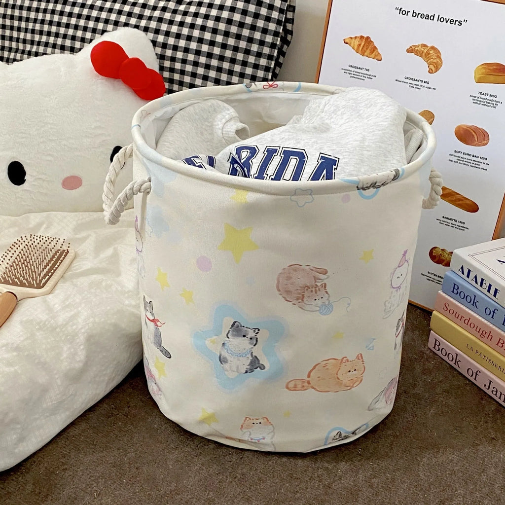 Foldable cotton laundry basket in mint green west highland pattern showing large capacity and collapsible design