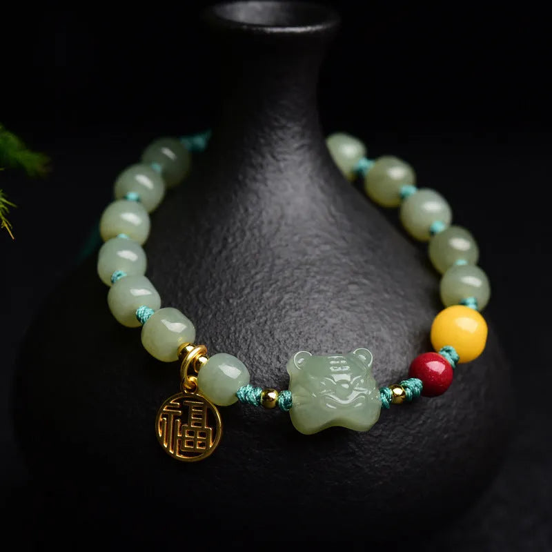 Natural Hetian jade and cinnabar beeswax bead bracelet with 5x7mm beads and Zodiac motifs