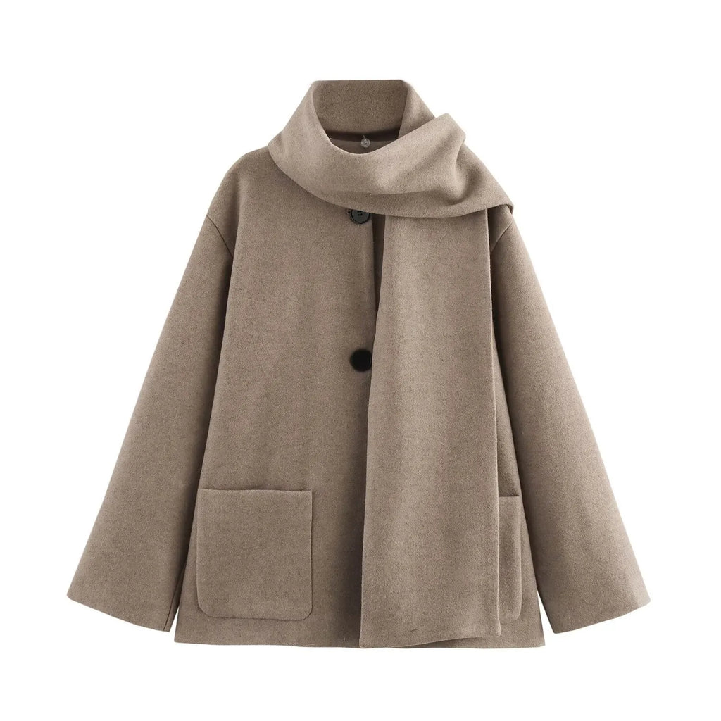 Women's long grey coat with artificial fur collar and street fashion styling