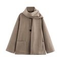 Women's long grey coat with artificial fur collar and street fashion styling