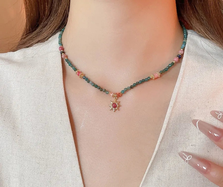 Freshwater pearl necklace with stone sun pendant on clavicle chain, blue or golden pink colour options
