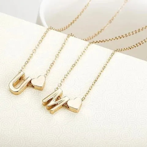Peach heart shaped letter necklace pendant in gold or silver alloy.