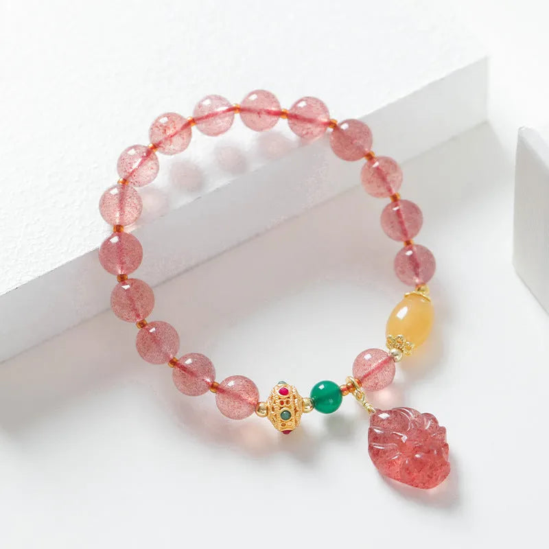 Polished crystal strawberry quartz beaded bracelet in a Nine Tail Fox style for women.