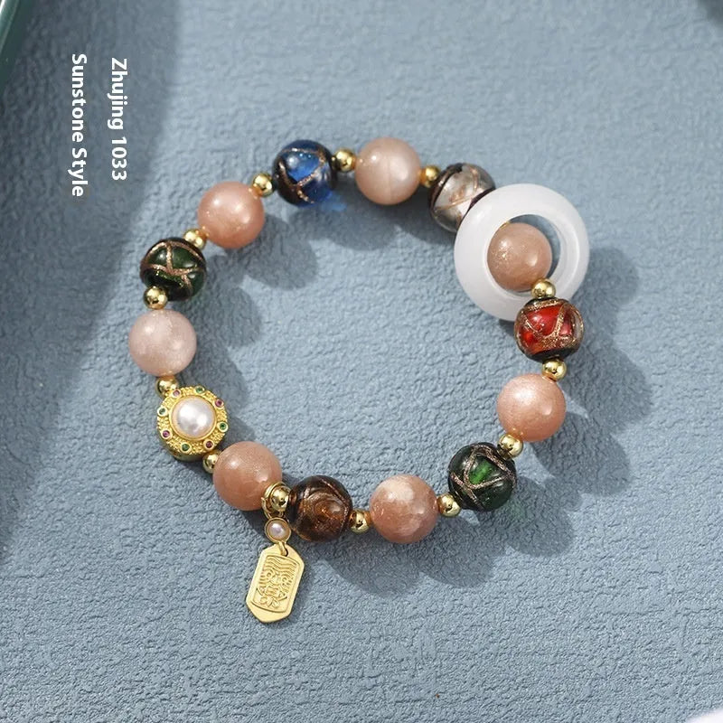 Hand-woven fragrant grey coloured glaze bracelet with natural stone beads on wrist