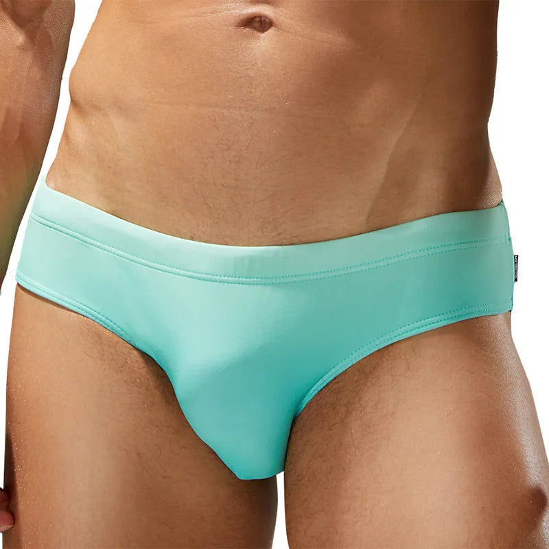 Men's solid colour triangle brief swim trunks in blue, grey, green, or rose red