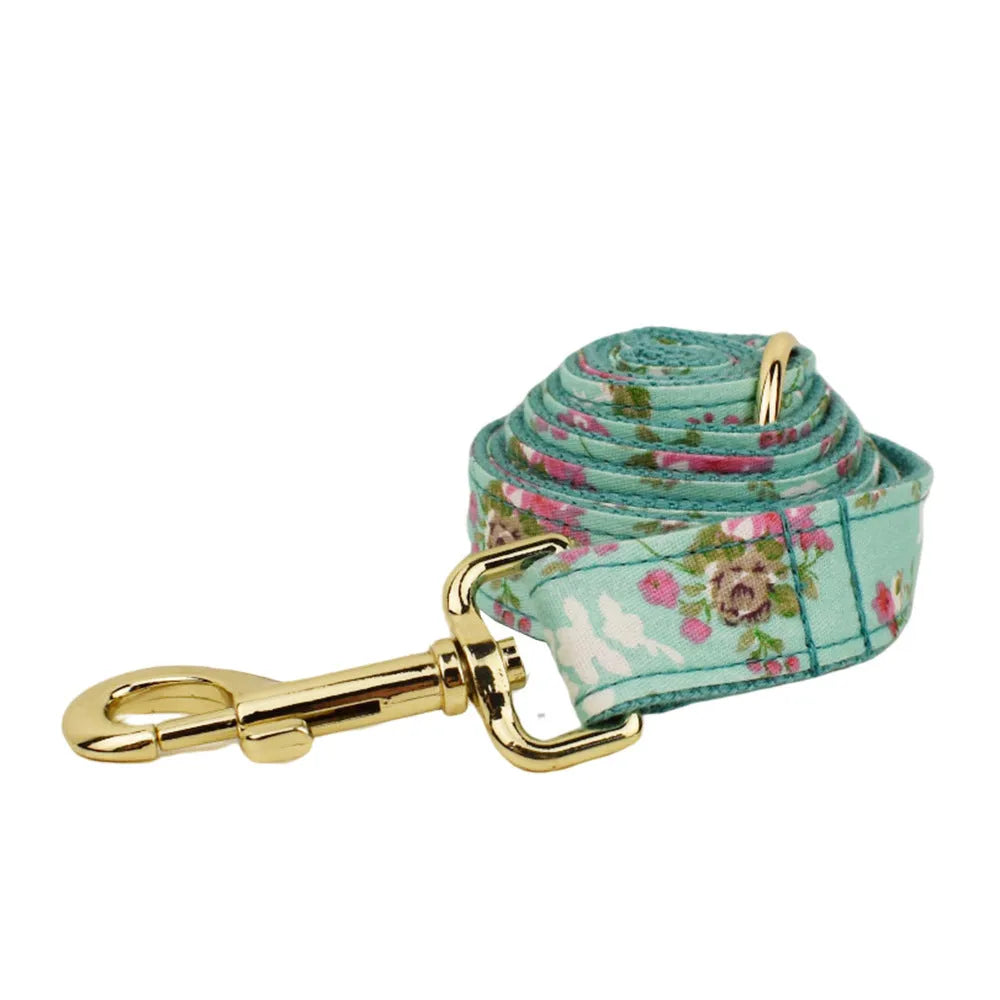 Rose pattern on green background fabric dog collar, leash, bow and vest four-piece pet set