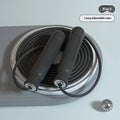 Black adjustable exam training skipping rope with wire construction and handles