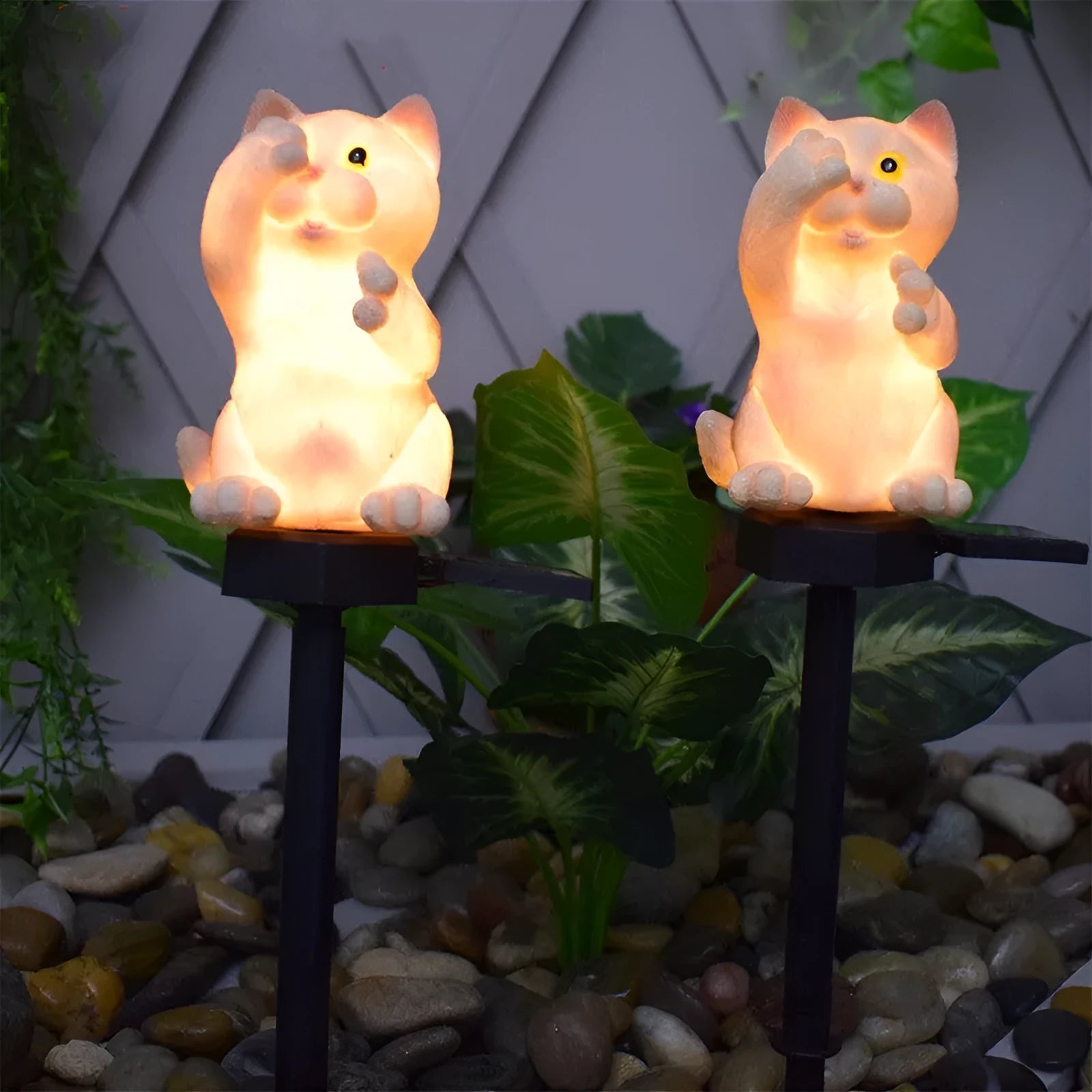 Brown resin cat-shaped solar garden light for outdoor decorative lighting.