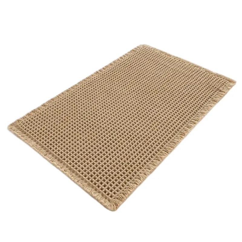 A square checkered pattern bathroom carpet with a non-slip backing in a neutral colour.