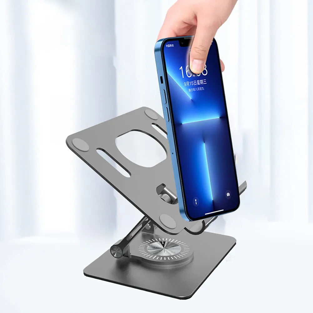 Rotating metal and silicone tablet stand in silver or black, showing adjustable height and 360-degree rotation.