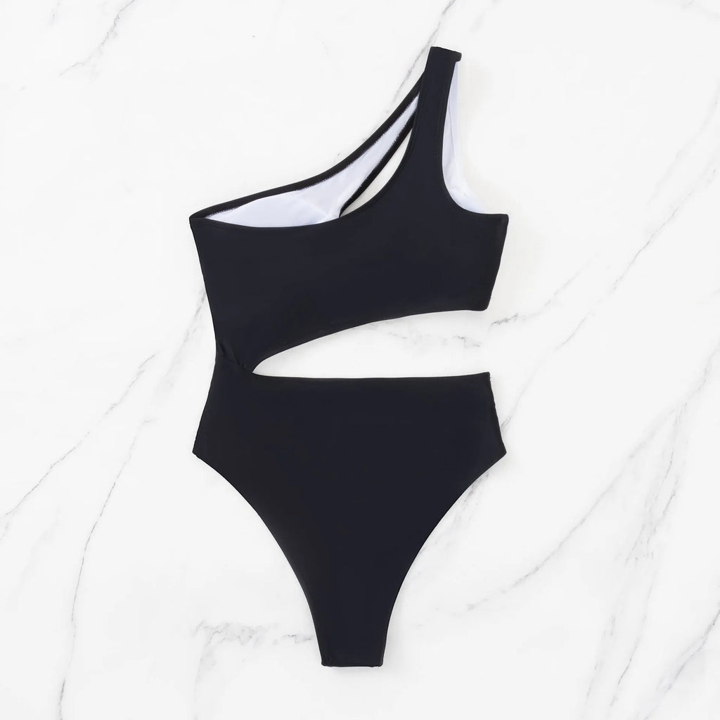 Black women's one-piece swimsuit with hollow cut-outs and white contrast stitching.