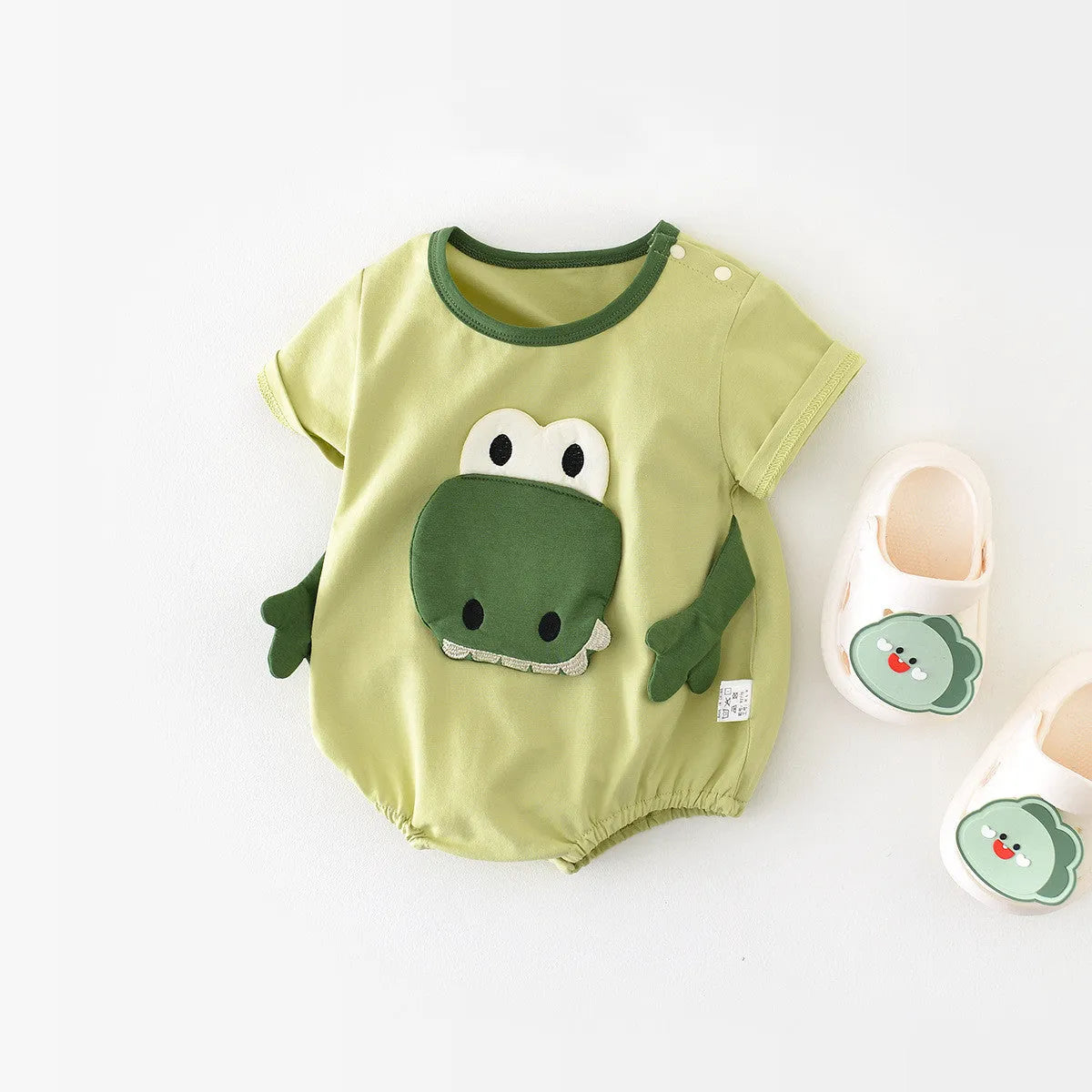Light green cotton cartoon dinosaur full moon jumpsuit for infants with pullover closure