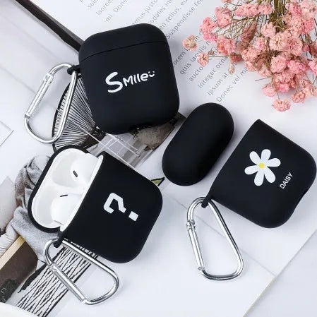Black and pink AirPods case covers with flower, love heart, and smiley face designs