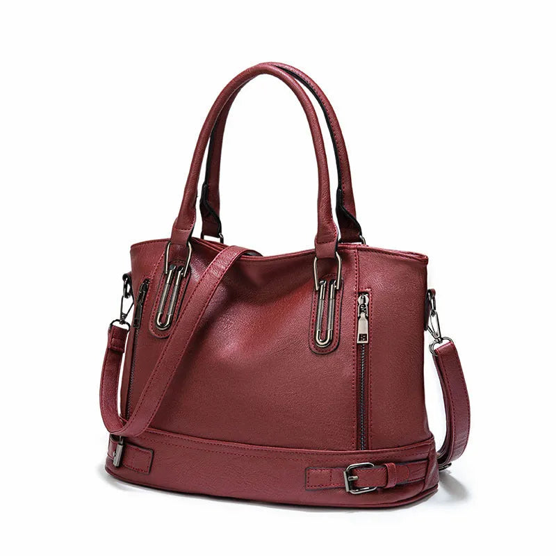 Women's PU leather handbag in black, horizontal square shape, with crossbody strap and sewing line detail