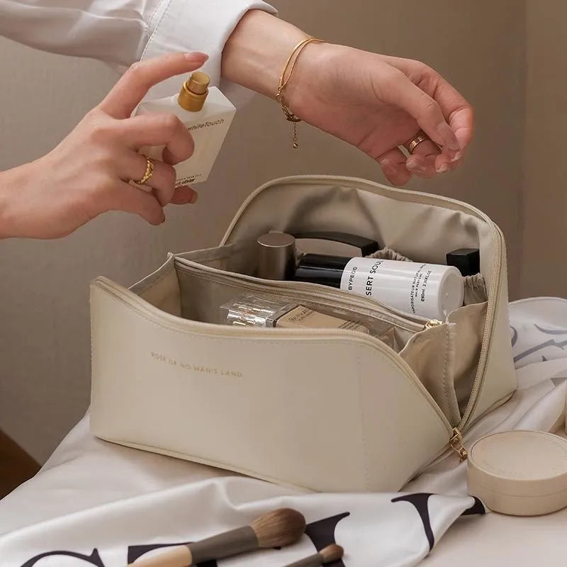 Large capacity travel makeup storage bag in brown PU leather with solid colour finish on white background