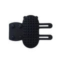 Silicone cat grooming comb with adjustable strap mounted on a table leg.