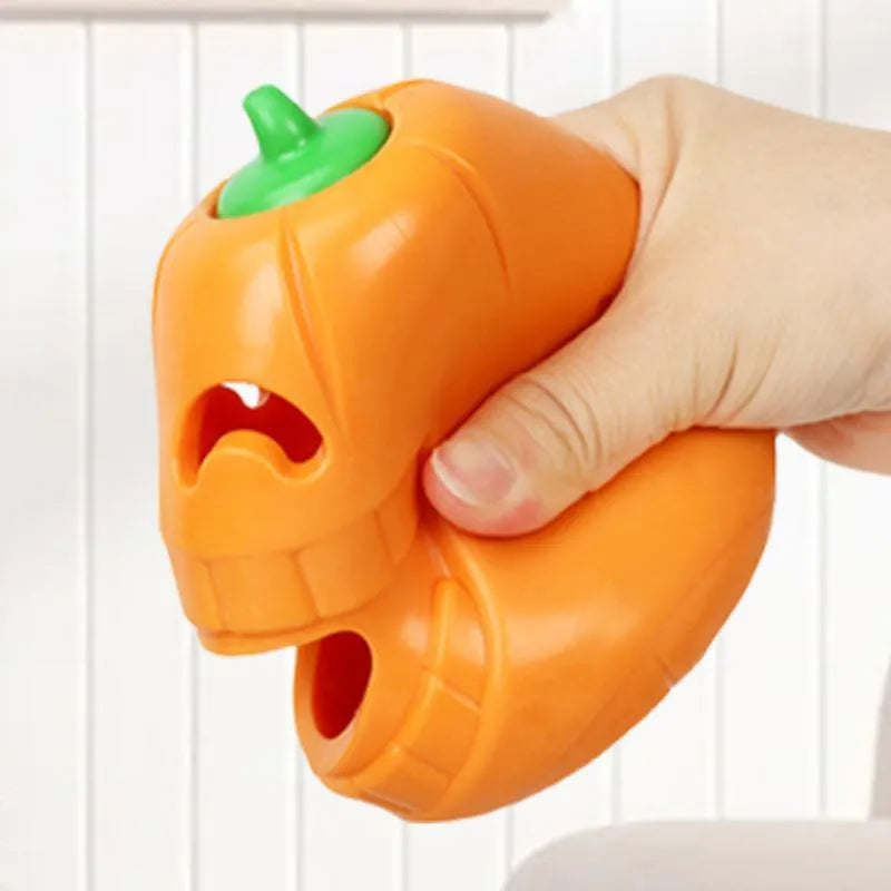 Yellow pumpkin-shaped TPR dog chew toy for aggressive chewers measuring 8.6 x 11.5 cm