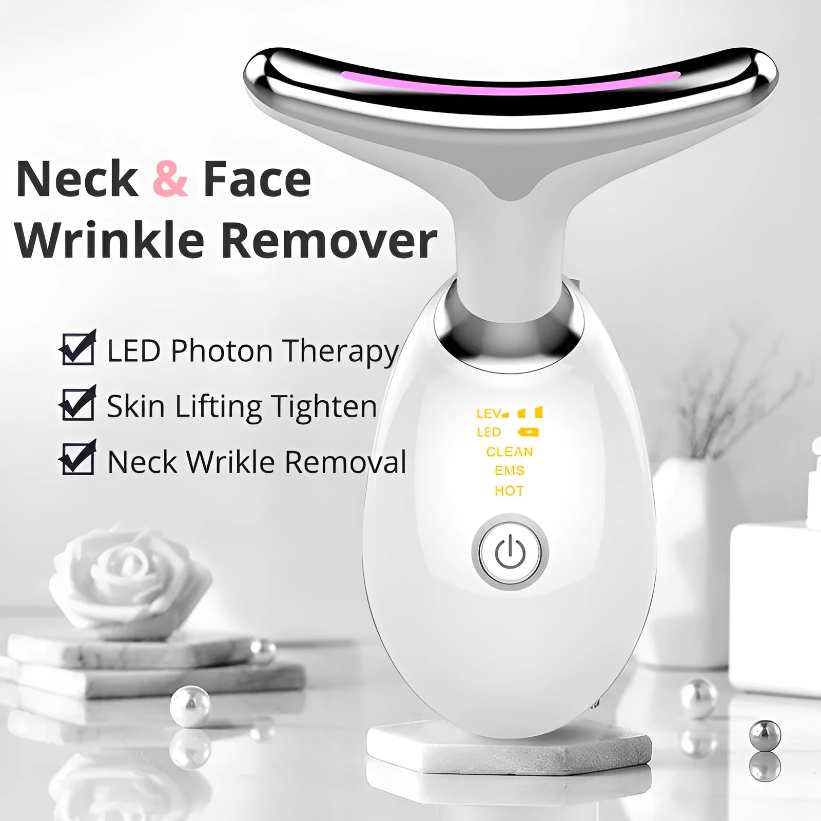 Black and silver EMS thermal neck lifting massager with LED lights on a skincare shelf.