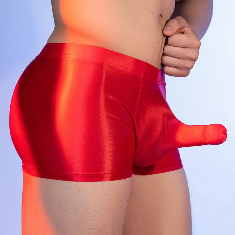 Men's thin nylon boxer shorts in red, showing seamless construction and mid-waist style.