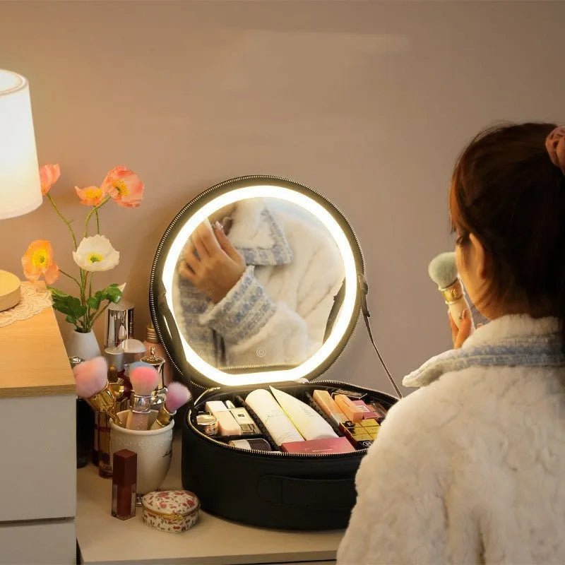 Round pink PU leather LED makeup bag open showing internal mirror, lights, and lattice partitions.