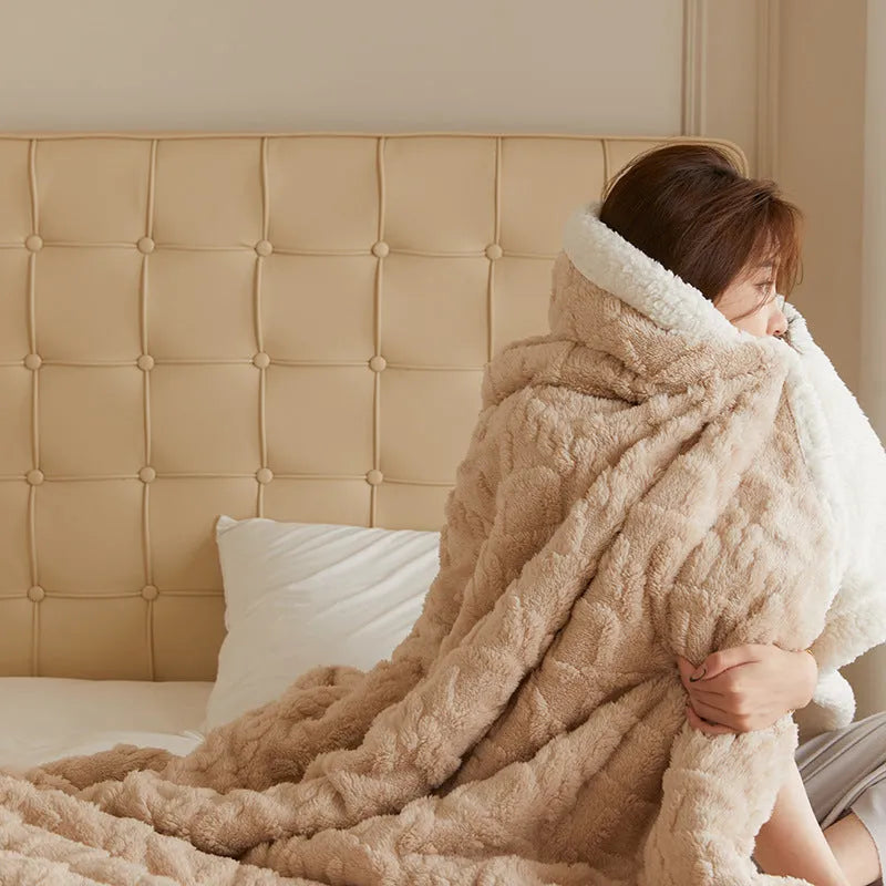A thick taffeta thermal flannel blanket for winter, shown in one of nine colours on a bed.