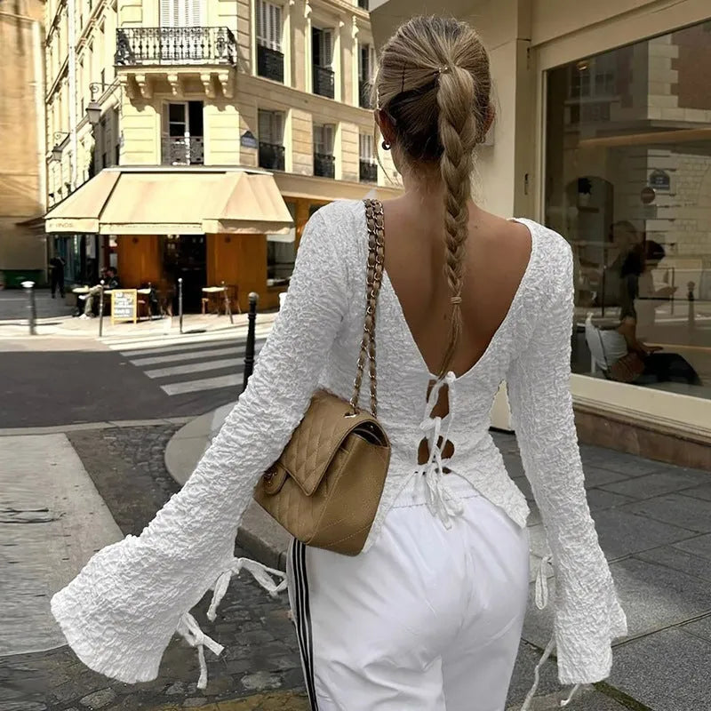 White lace-up backless long sleeve cardigan on a woman for casual layering
